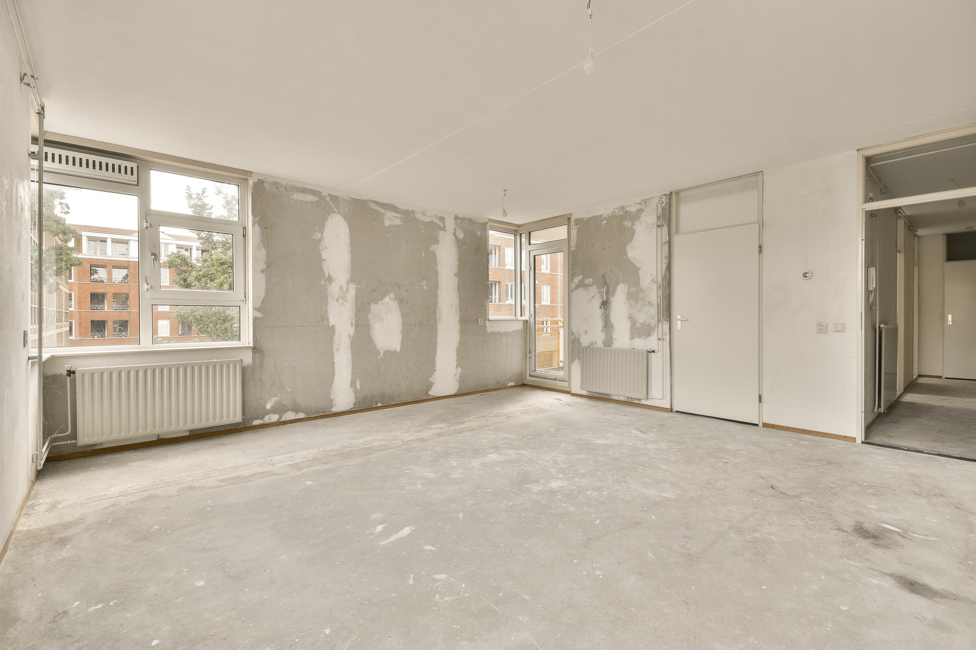 the living room of an empty house with no furniture