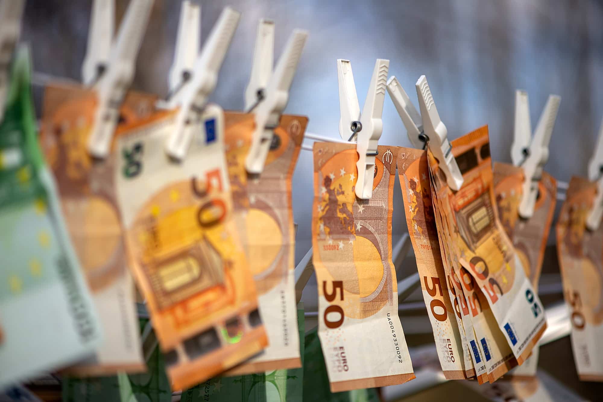100 and 50 euro banknotes drying. Washed Euro paper bills. Drying euro on a string.Money laundering.
