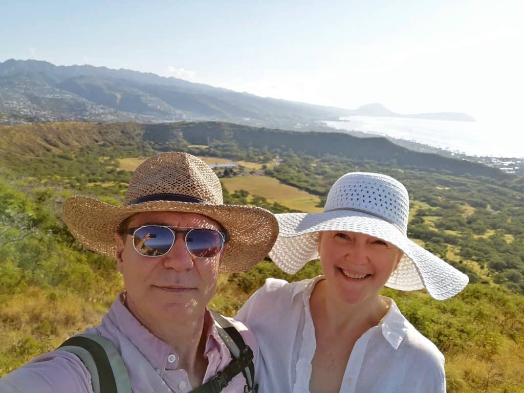 Smiling seniors couple happy to travel and enjoy nature